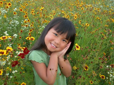 Kasen posing in field of flowers